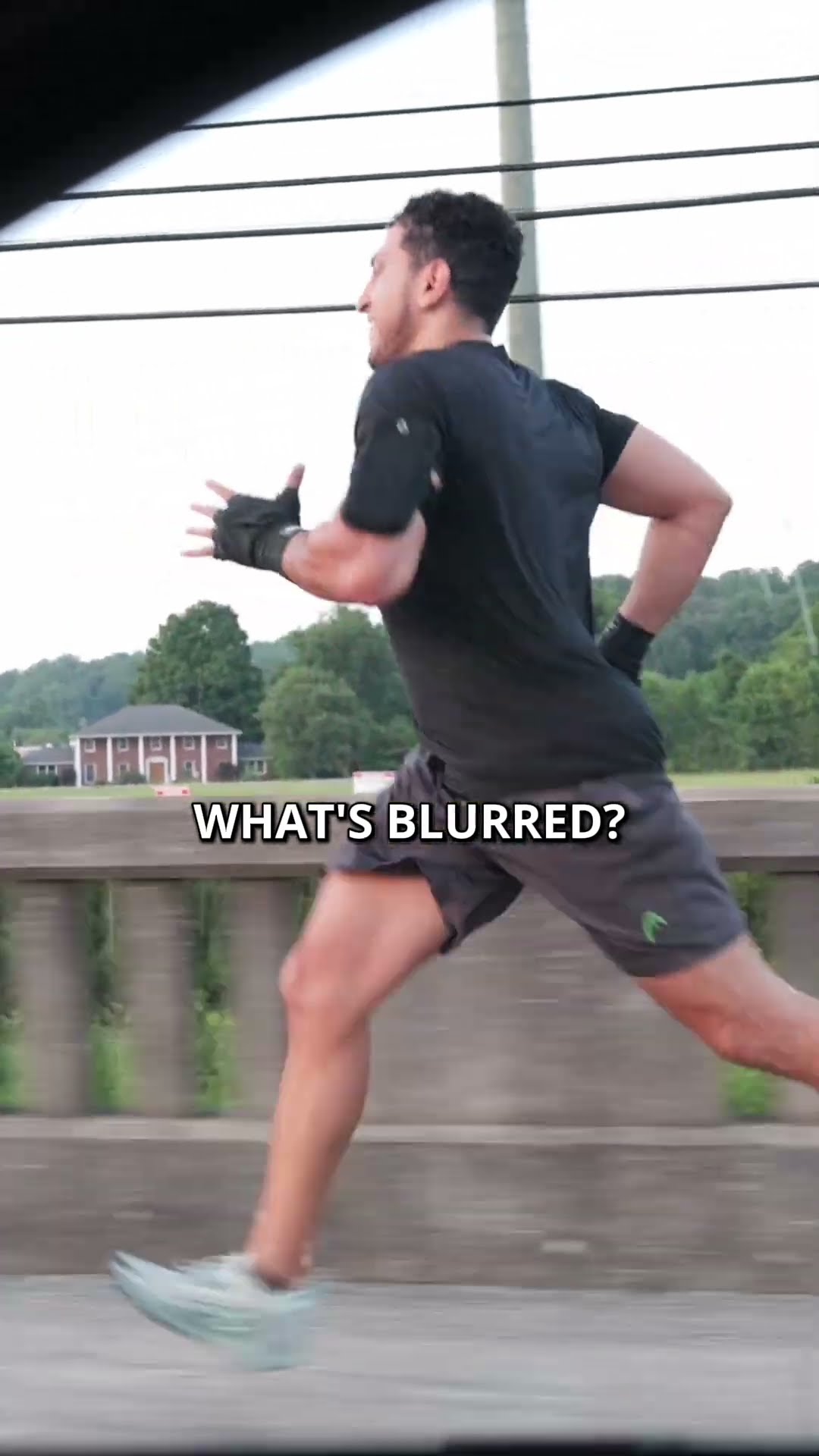 Ibrahim J. Awad running across a bridge in training gear, captioned "What's blurred?"