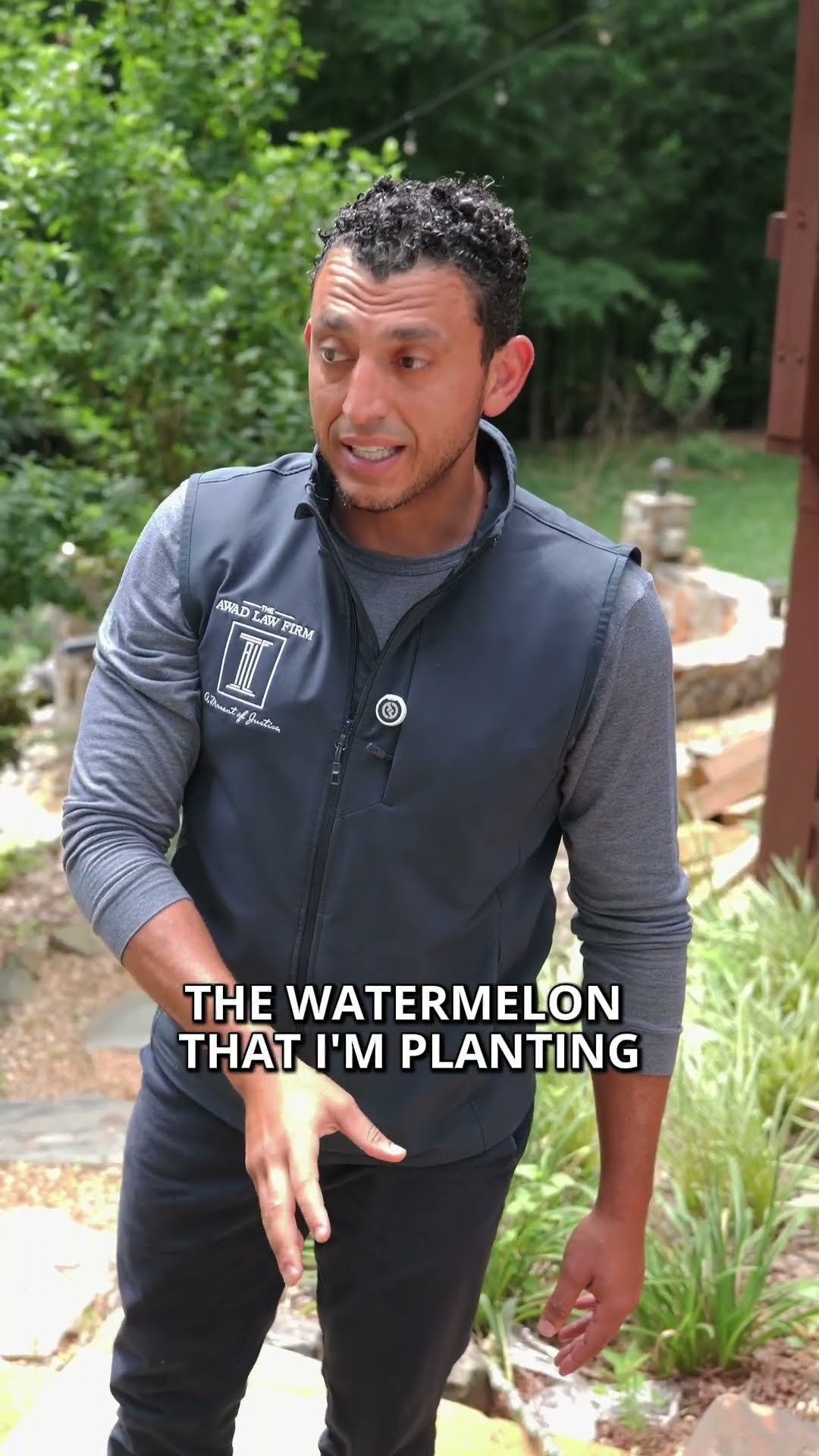 Ibrahim J. Awad in a firm-branded gilet walking through a garden, captioned "The watermelon that I'm planting"