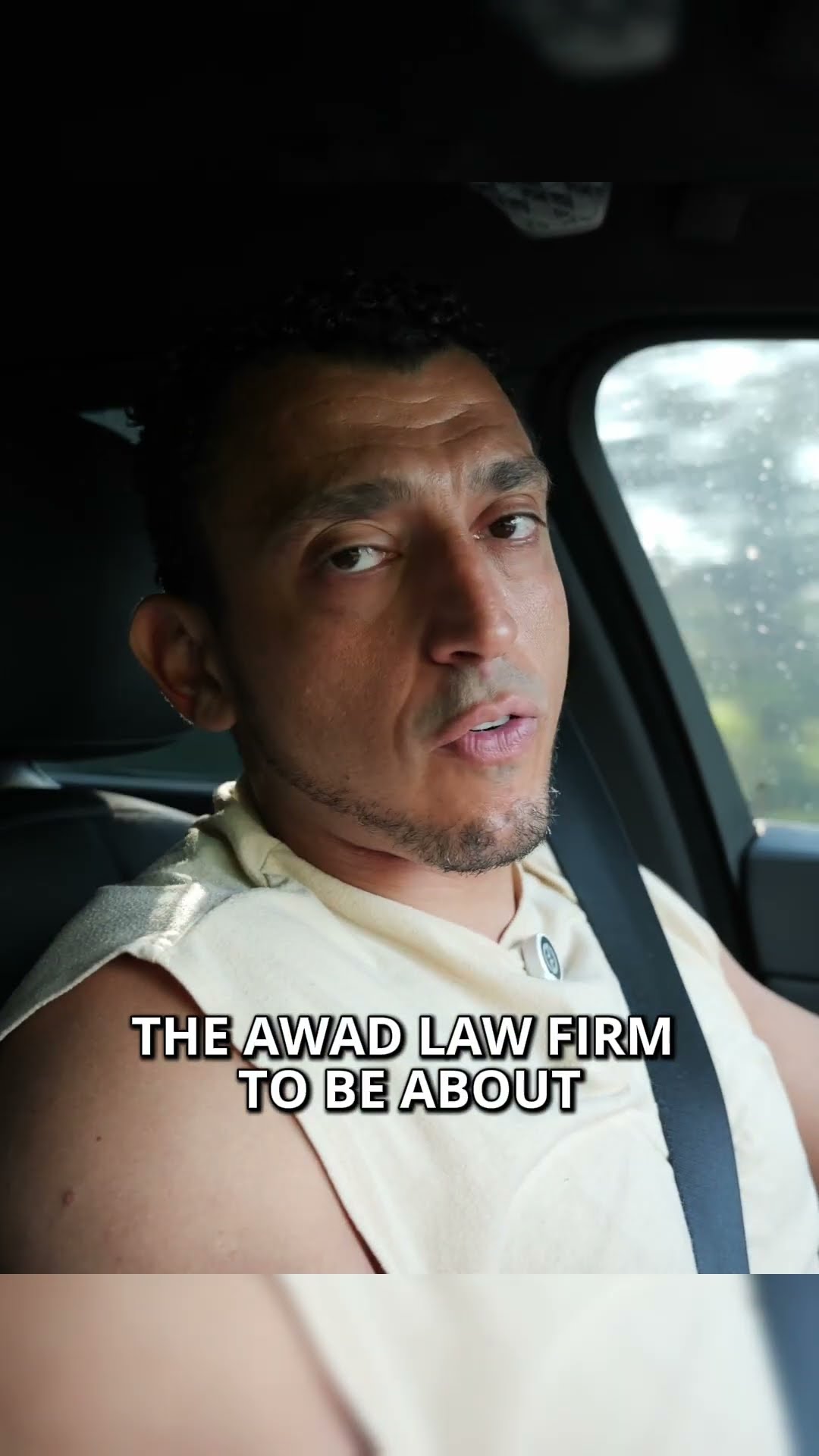 Ibrahim J. Awad talking to camera from a car, captioned "The Awad Law Firm to be about"