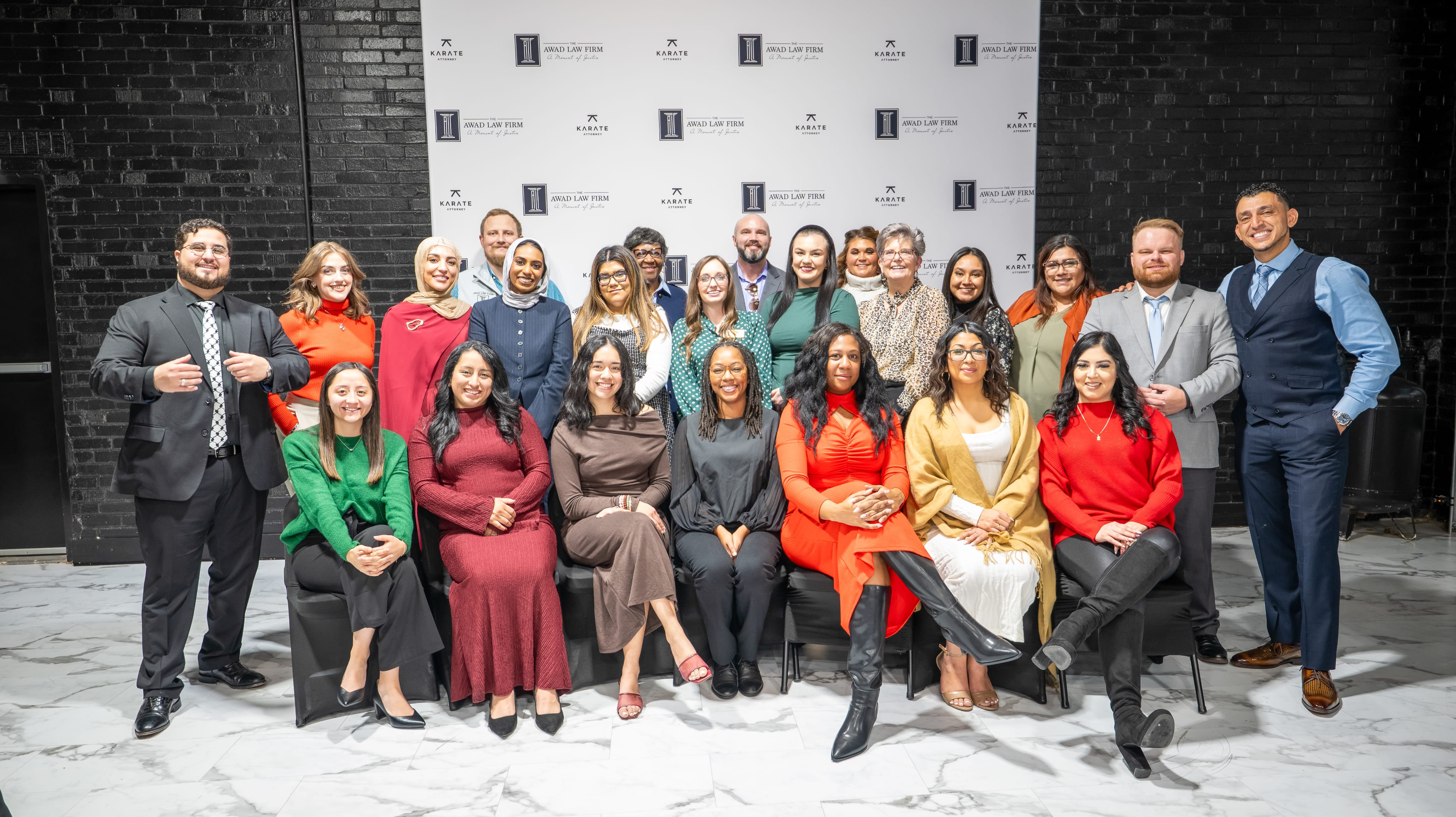 The Awad Law Firm team photographed together at a firm event